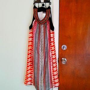 Sleeveless knee length dress. Size XL Maker Luxology. Beads around neck.